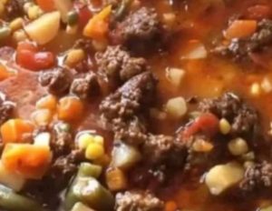 Ingredients :
2 lbs Ground Beef
4 Yukon Gold Potatoes (peeled, cubed)
2 cans (15oz) Mixed Vegetables, undrained
1 can (15oz) Sweet Corn, undrained
1 can (10.75oz) Condensed Tomato Soup
1 can (14.5oz) Diced Tomatoes
1 can (14.5oz) Cut Green Beans, undrained
Salt & Pepper to taste
2 tbsp Sugar (secret ingredient)
Instructions :
Prep:
Peel and cube potatoes → brown/drain beef.

Combine:
Add beef + potatoes to 6-qt slow cooker.
Pour in all canned ingredients (undrained).

Season:
Add salt, pepper, and sugar → stir well.